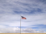 An American Flag Waves in the Breeze Photographie par Jim Webb