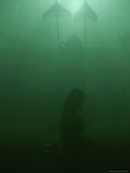 A Woman Praying in a Temple Photographic Print