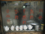 Teapots on the Sill of a Restaurant Window Covered with Steam Photographic Print by Ed George