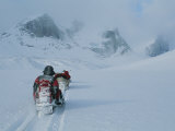 Climbers Travel over Baffin Island Via Snowmobile-Towed Sleds Photographic Print by Gordon Wiltsie
