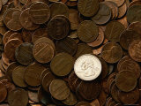 Single Quarter on a Mound of Pennies Photographic Print