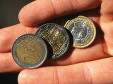 Hand Holding Euro Coins Photographic Print