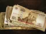Stack of World Currencies with Rubles on Top Photographic Print