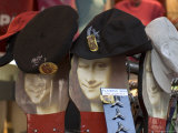 Display of Hats Perch on Cardboard Faces of the Mona Lisa Photographic Print