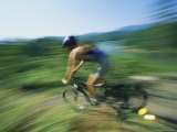 Panned View of a Mountain Biker Rounding a Curve Photographic Print by Stephen Alvarez