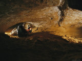 Caver Crawls Through Mammoth Cave during the Wild Cave Tour Photographic Print