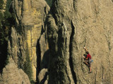 Man Climbing Eve Tooth Rock Formation in the Needles Photographie