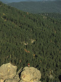 Young Woman Taking in a View from a Rock Formation in the Black Hills Photographie