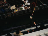 Food Vendors on a Dock Pass Food in Baskets to People on a Riverboat Photographic Print by Justin Guariglia