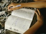 Student at the Ta Gou Martial Arts Academy Reads a Textbook Photographic Print