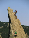 Men Climbing Eve Tooth Rock Formation in the Needles Photographie