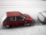 Winter Storm Freezes Ice on the Road, Trapping a Parked Car Photographic Print