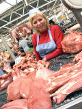 A Butcher Sells Meat at the Food Market Photographic Print