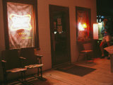 A Woman Uses a Pay Phone at a Bar Photographie