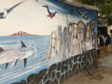 Mural Painting of People and Wildlife Near a Sidewalk Cafe Photographic Print