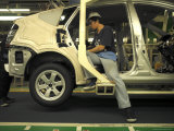 An Auto Worker Assembling a Hybrid Car at Plant in Japan Photographic Print