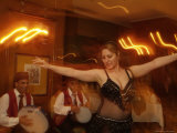 A Belly Dancer Entertains at the Sheraton Hotel Dinner Theater Photographie