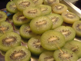 Street Vendors Sell Slices of Kiwi Fruit on Skewers Photographic Print