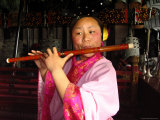 The Musician is Playing a Chinese Flute at the Temple of Eternal Photographic Print by Richard Nowitz