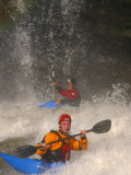 Whitewater Kayakers Surfing a Large Wave Photographic Print