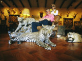 A Couple with Stuffed Animals, Hides and Heads Photographic Print by Joel Sartore