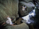 Archeologists Boulder Hop Through the Massive Rio Frio Cave Photographic Print