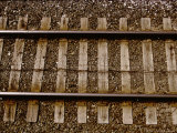 A Straightforward View from Above of Standard Railroad Tracks Photographic Print by Stephen St. John