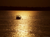 Morning Sun Silhouettes a Workboat Checking a Line of Crabpots Photographic Print by Stephen St. John