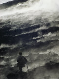 A Man Walking Across Steaming Ground Near an Active Volcano Photographic Print by Bill Curtsinger