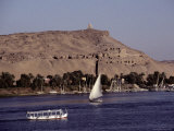 A Scenic View of Boats Gliding Along the Nile Near the Aswan Harbor Photographic Print by Stephen St. John