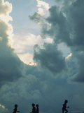 Children Playing with Toy Gliders Under a Cloud-Filled Sky, Wichita, Kansas Photographic Print