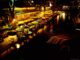 The Popular Riverwalk Lights up with Color on a Summer Evening Photographic Print by Stephen St. John