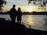 A Couple Admire the Sunset Over the Lake Chiemsee in Bavaria, Fraueninsel, Germany Photographic Print by Taylor S. Kennedy