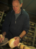 A Man Washes Cheese with Salt Water in During the Ageing Process, Pontresina, Switzerland Photographic Print
