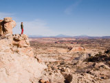 A Woman Looks Out at the View of the Geologic Layers of Rock, Grand Staircase National Monument, UT Photographic Print by Taylor S. Kennedy