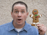 A Male Mimics a Gingerbread Cookie's Expression Photographic Print by Joel Sartore