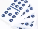 Pile of Black and White Dominoes Against White Background Lámina fotográfica