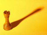 Wooden Knight Chess Piece with Shadow in Yellow Light Lámina fotográfica Wooden Knight Chess Piece with Shadow in Yellow Light Lámina fotográfica
