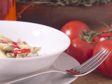 Fork Beside Bowl of Pasta and Tomatoes Lámina fotográfica Fork Beside Bowl of Pasta and Tomatoes Lámina fotográfica