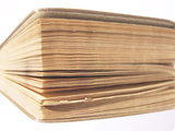 Close-up of Worn Hardcover Book with Yellowed Pages Photographic Print