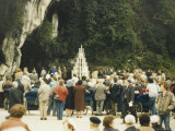 Pilgrims Gather at the Grotto Photographie
