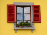 A Yellow House and a Window with Red Shutters and a Flower Box Photographic Print