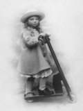 Girl in Smart Hat and Coat with Her Scooter Photographic Print