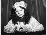 Young Woman Holds and Interprets a Crystal Ball Photographic Print