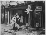 Shop Owner Poses with Two Mannequins Following the Destruction of His Shop by German Bombers Photographic Print