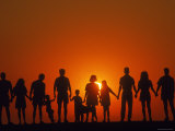 Large Family Silhouetted at Sunset Photographic Print