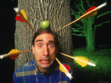 Man with Arrows Being Shot at His Head Photographie par Dan Gair