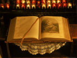 Open Bible and Prayer Candles in Background Photographic Print by Sylvia Bissonnette