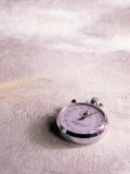 Stopwatch on Light Textured Background Photographic Print by Greg Smith