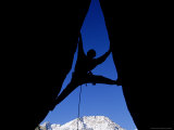 Silhouette of Man Rock Climbing on Split Rock, CA Photographic Print by Greg Epperson